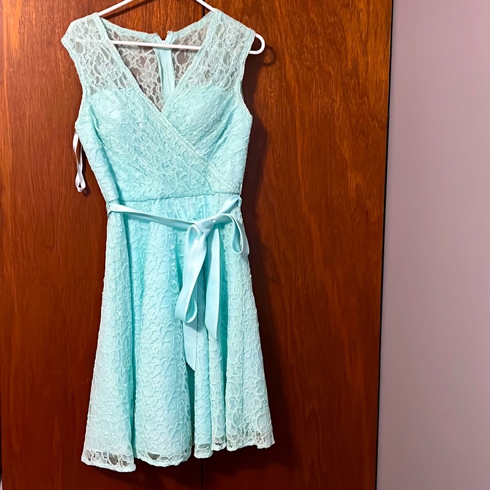 Teal bridesmaid dress.